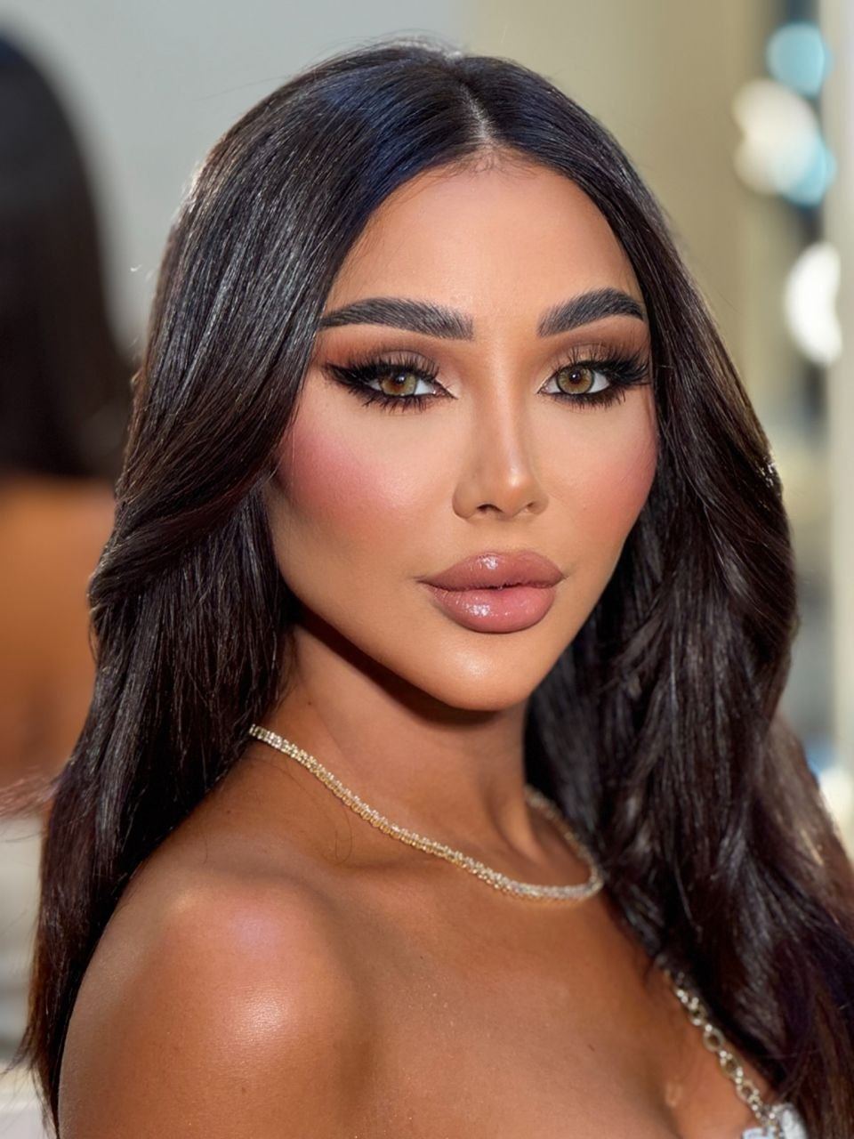 Close-up portrait of Zina Almokri showing her complexion and eye makeup in detail